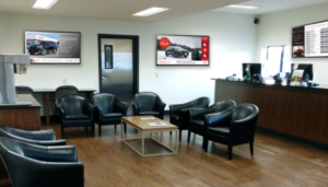 How Digital Signage Reduces Perceived Wait Time in Dealerships?